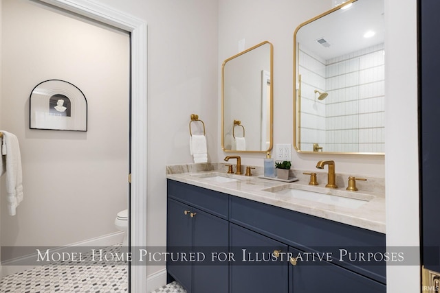 full bath featuring visible vents, a sink, toilet, and double vanity