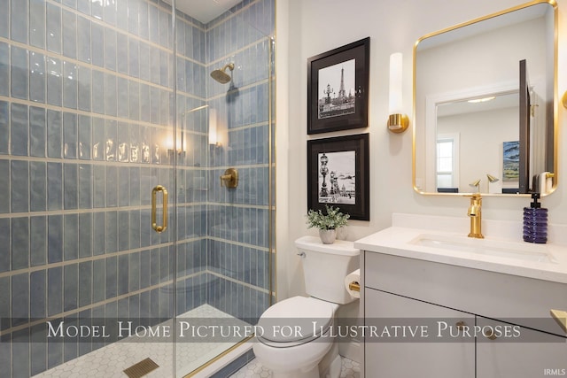 bathroom featuring toilet, a stall shower, and vanity