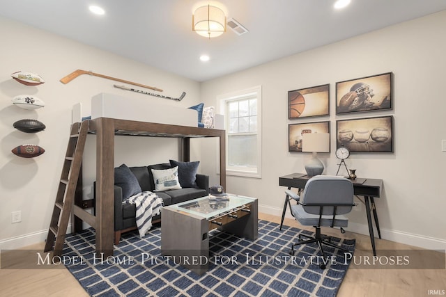 bedroom featuring baseboards, wood finished floors, visible vents, and recessed lighting