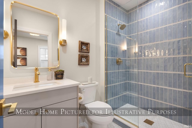 bathroom featuring a stall shower, vanity, and toilet