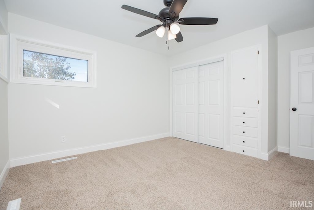 6400 Jefferson Ave, Evansville, IN 47715 - unfurnished bedroom featuring carpet, a closet, ceiling fan, and baseboards