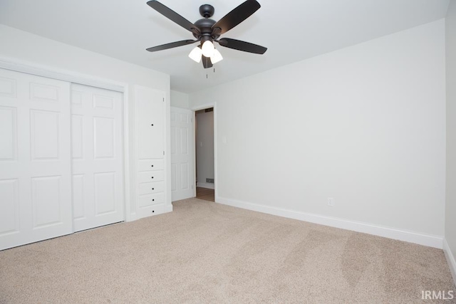 6400 Jefferson Ave, Evansville, IN 47715 - unfurnished bedroom featuring carpet, baseboards, ceiling fan, and a closet