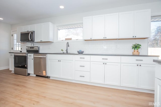 6400 Jefferson Ave, Evansville, IN 47715 - kitchen with white cabinetry, appliances with stainless steel finishes, and a sink