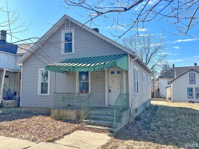 view of front of house featuring a porch and metal roof