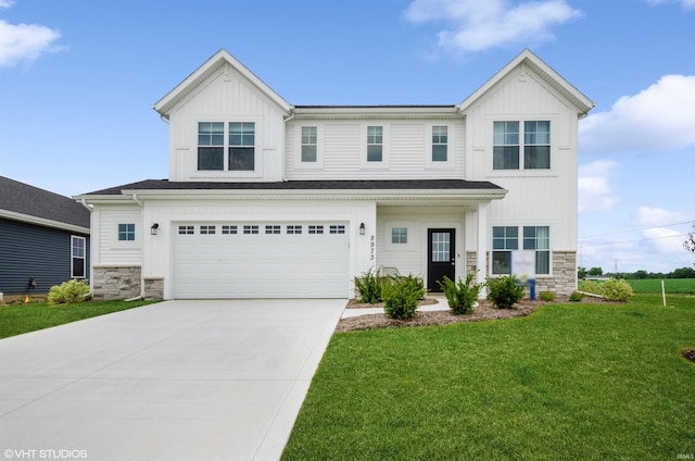8973 Belmont Woods, Fort Wayne, IN 46835 - view of front of home with a garage, stone siding, driveway, a front lawn, and board and batten siding