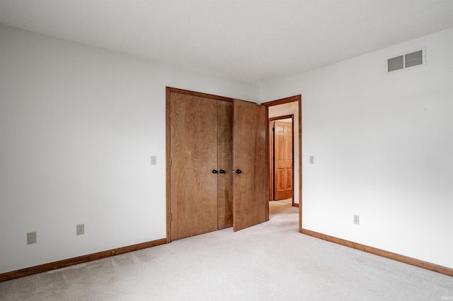7910 Moss Grove Pl, Fort Wayne, IN 46825 - unfurnished bedroom featuring baseboards, light carpet, a closet, and visible vents