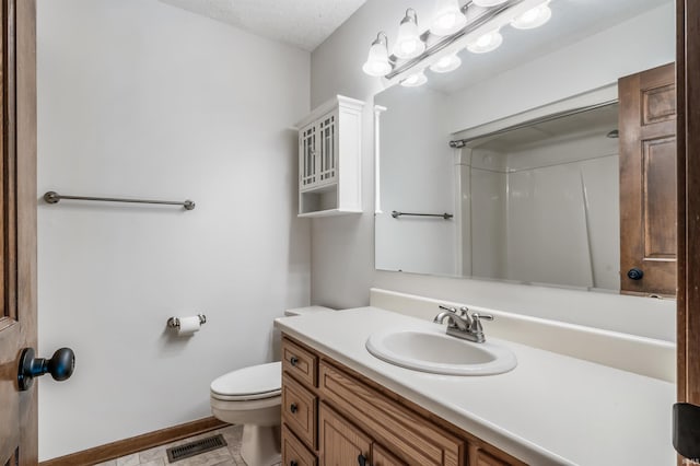 7910 Moss Grove Pl, Fort Wayne, IN 46825 - full bath with a textured ceiling, visible vents, a shower, vanity, and toilet