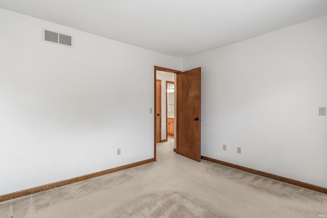 7910 Moss Grove Pl, Fort Wayne, IN 46825 - empty room with visible vents, baseboards, and light colored carpet