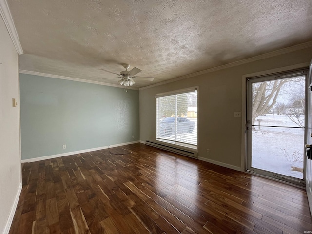 spare room with dark wood-style floors, ornamental molding, baseboard heating, and a textured ceiling