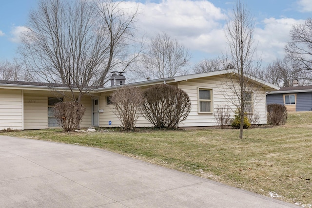 ranch-style home featuring a front yard