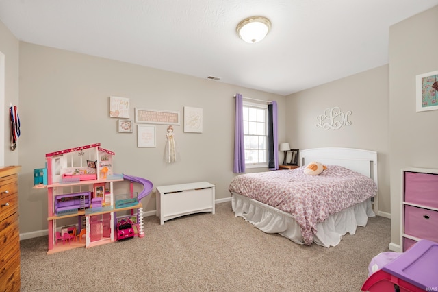 bedroom with carpet, visible vents, and baseboards