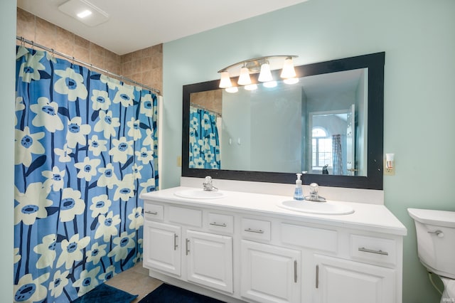 bathroom featuring double vanity, a sink, and a shower with curtain