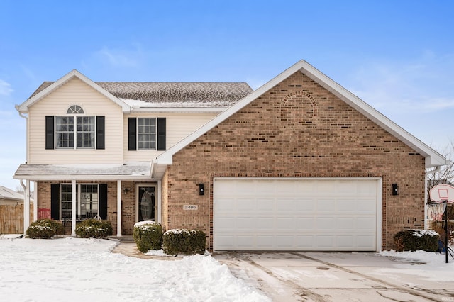 traditional-style home with a garage and brick siding