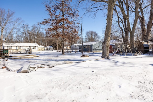 snowy yard with playground community