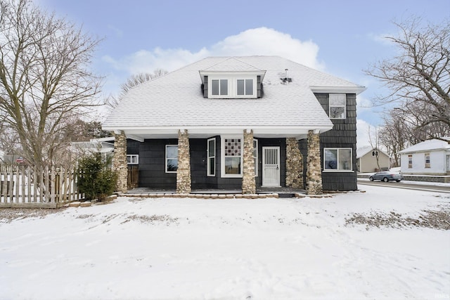 view of front of home featuring fence