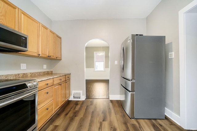 602 N Harrison St, Alexandria, IN 46001 - kitchen with stainless steel appliances, light countertops, dark wood-style flooring, and visible vents