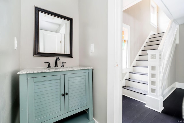 602 N Harrison St, Alexandria, IN 46001 - bathroom featuring baseboards, wood finished floors, and vanity