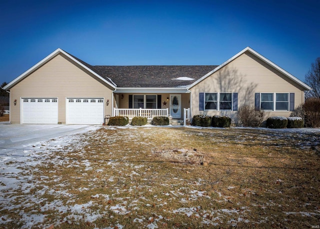 single story home featuring a garage, covered porch, and concrete driveway