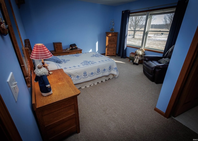 carpeted bedroom with baseboards