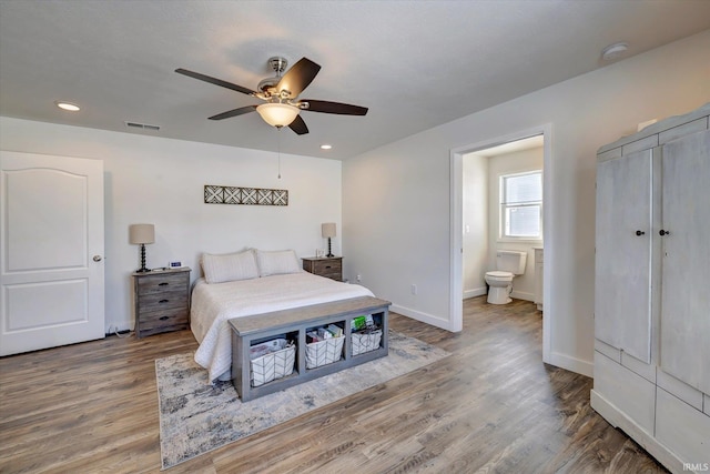 bedroom featuring visible vents, baseboards, a ceiling fan, wood finished floors, and recessed lighting