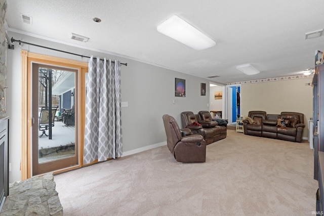 living room featuring light carpet, a textured ceiling, visible vents, and baseboards