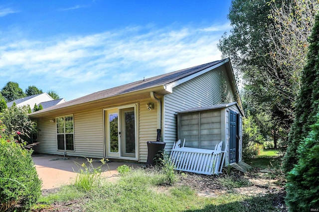 back of property featuring a patio area