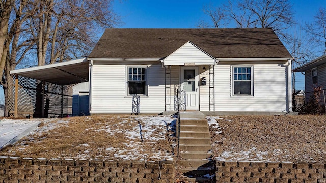 view of front of home featuring a shingled roof