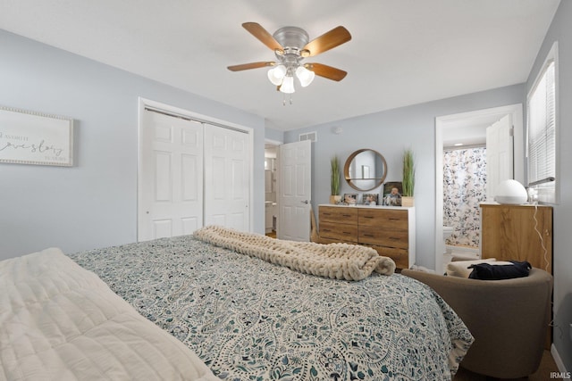 bedroom with ceiling fan, visible vents, and a closet