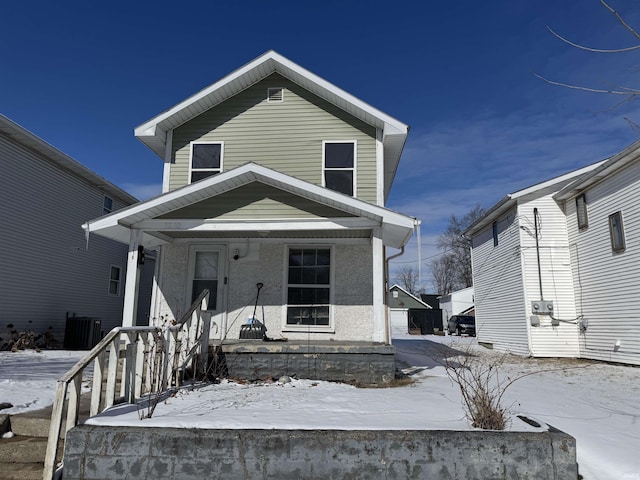 view of front of house with covered porch and central AC unit