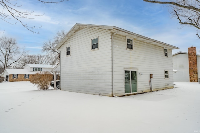 view of snow covered house