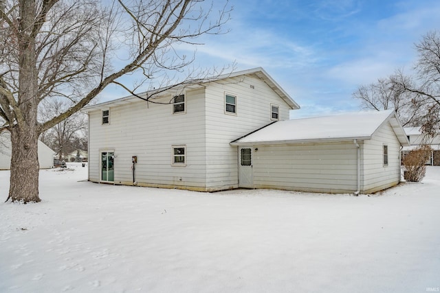 view of snow covered house