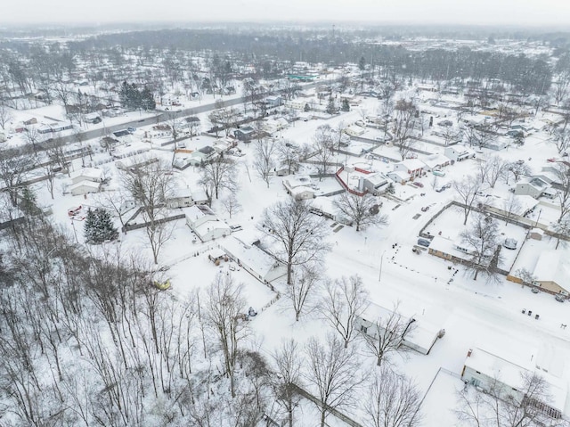 snowy aerial view featuring a residential view