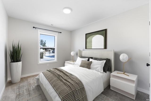 bedroom featuring carpet floors, visible vents, and baseboards