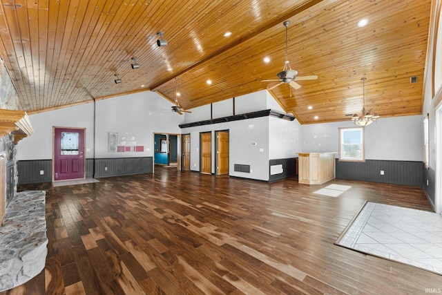 unfurnished living room featuring a wainscoted wall, a fireplace, wood finished floors, high vaulted ceiling, and wooden ceiling