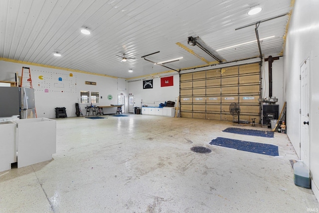 garage with freestanding refrigerator