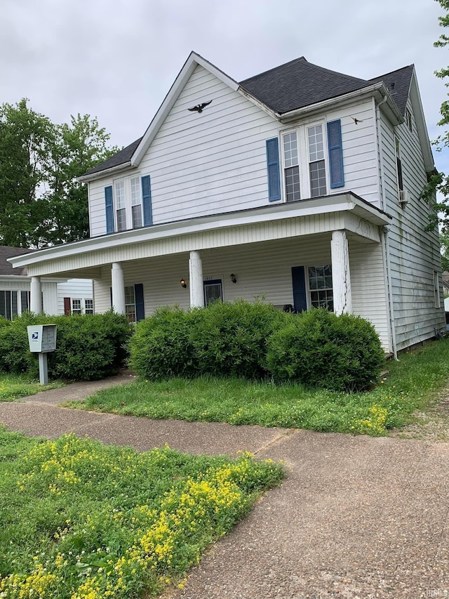 view of front of property with roof with shingles