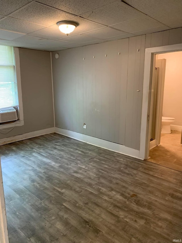 1419 Cumberland Ave, Evansville, IN 47712 - unfurnished room with a paneled ceiling, dark wood-style floors, and cooling unit