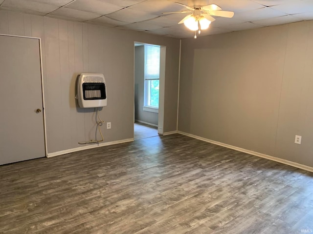 1419 Cumberland Ave, Evansville, IN 47712 - empty room featuring dark wood-type flooring, a drop ceiling, a ceiling fan, and heating unit