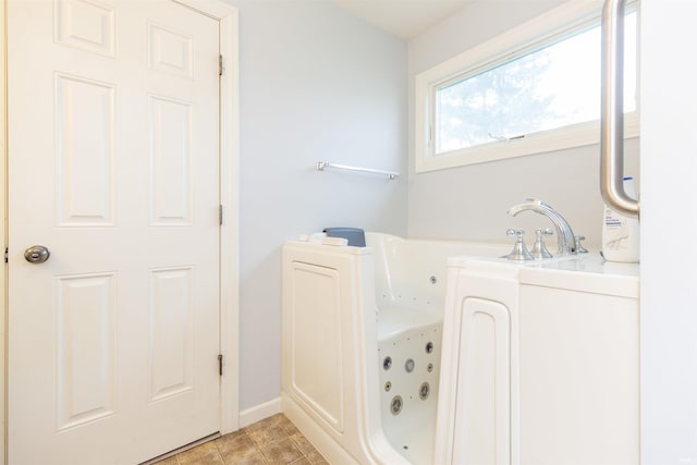 bathroom featuring a whirlpool tub