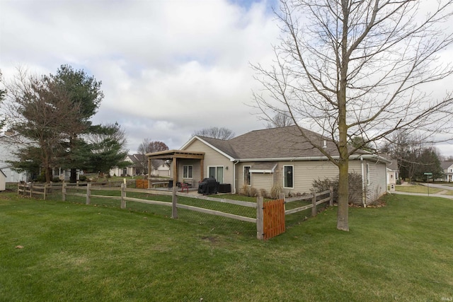 bungalow-style home featuring a front lawn and a fenced front yard