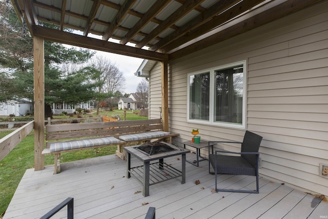 deck featuring an outdoor fire pit