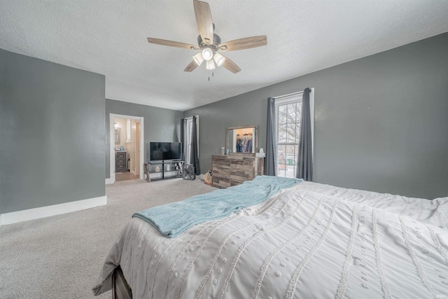 bedroom with light carpet, ceiling fan, a textured ceiling, and baseboards