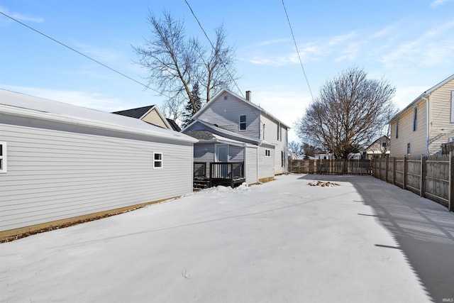 back of house with a fenced backyard