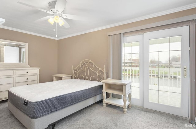 carpeted bedroom with ceiling fan, ornamental molding, and access to exterior