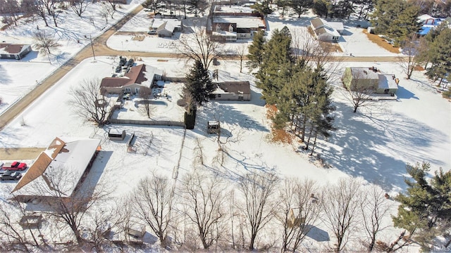 snowy aerial view featuring a residential view