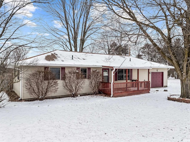 single story home with covered porch and an attached garage