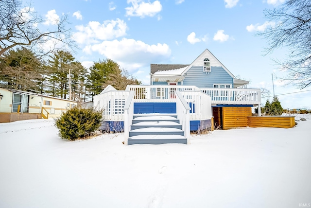 view of front facade with stairs and a deck