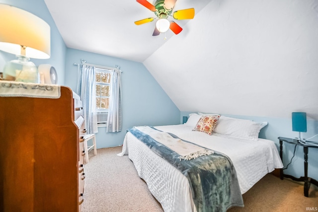 bedroom featuring vaulted ceiling, a ceiling fan, and light colored carpet