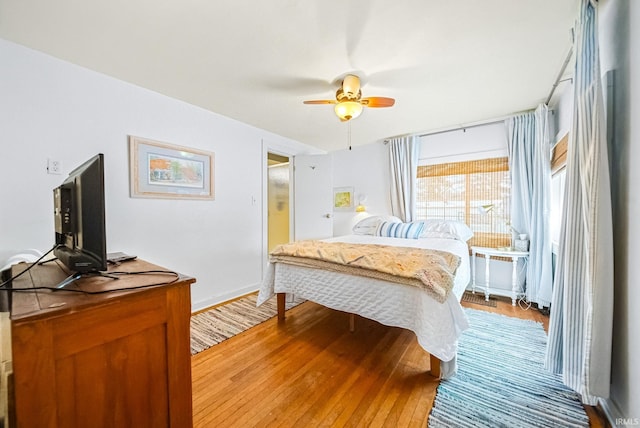 bedroom featuring a ceiling fan and light wood finished floors