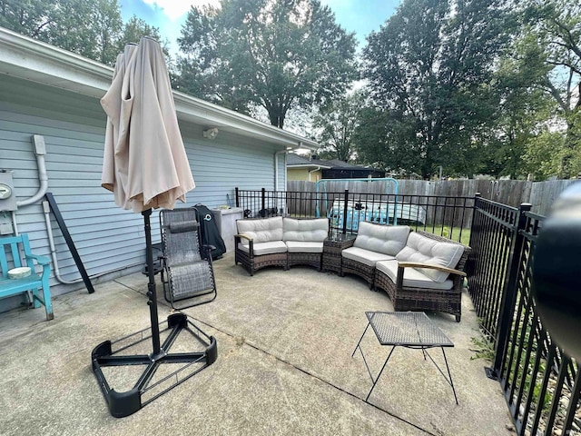 view of patio with outdoor lounge area and a fenced backyard